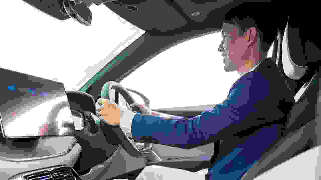 man driving a car